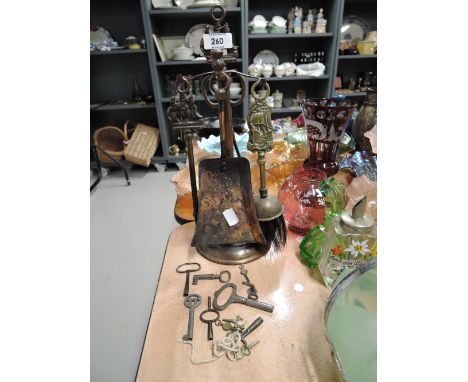 A selection of vintage clock work and similar keys also fire side companion set