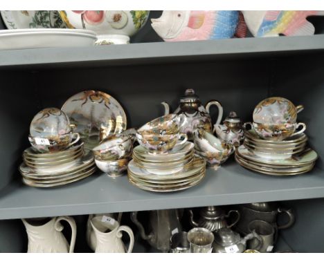 A vintage egg shell china part tea service in a Japanese design