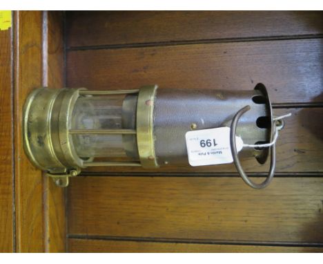 A brass miner's lamp