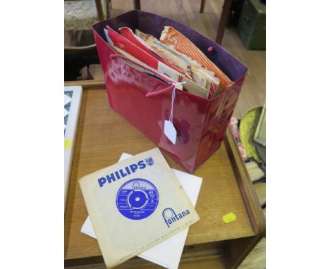 A collection of 45rpm singles from the 1960s and 1970s including The Beatles: I Feel Fine, Strawberry Fields Forever, Ticket 