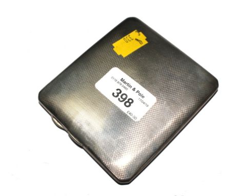 A silver cigarette case with engine turned decoration