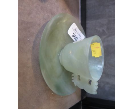 A jade cup and saucer, with flat carved handle, saucer 11.5cm diameter