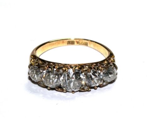 An 18 carat gold five stone diamond ring