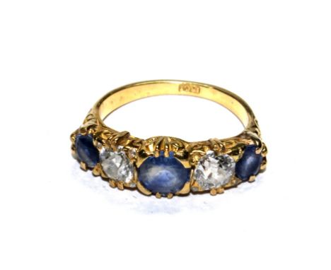 An 18 carat gold five stone sapphire and diamond ring