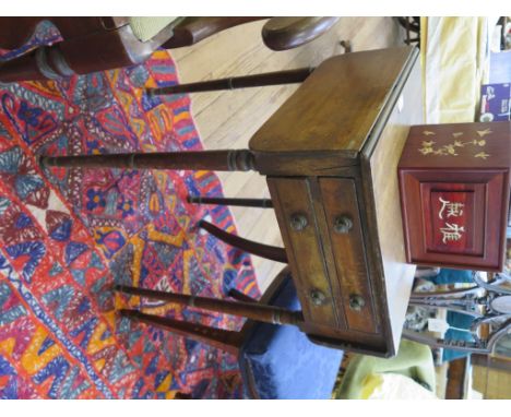An early 19th century mahogany Pembroke table, with two frieze drawers on ring turned tapering legs 42cm wide, 43.5cm deep, 7