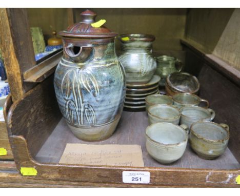 An Abuja coffee set in blue/green glaze including six coffee cups and saucers, another saucer, two jugs, a sugar bowl and ano