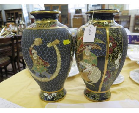 A pair of Japanese stoneware vases with enamel decoration of figures and a dragon, six character mark 32.5cm high (2)