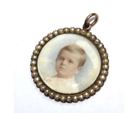 A portrait brooch of a young child, set in seed pearls