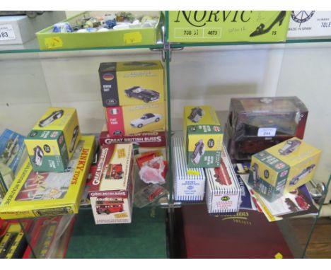 Diecast vehicles: three Atlas edition Dinky issues, nine Atlas sports cars, fire service, buses, all in boxes, two badges and