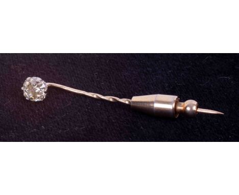 A yellow gold (not hallmarked or tested) stick pin set with an old cushion cut diamond, approx. 0.90 carats (slightly hard to