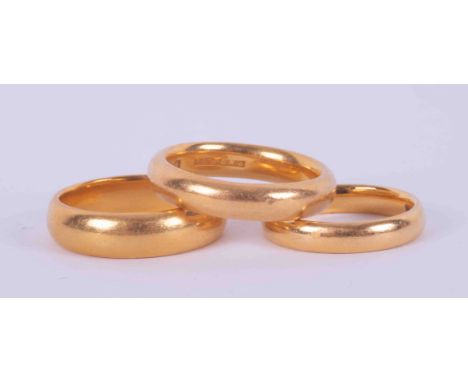 Three 22ct yellow gold wedding bands, one 4.7mm wide, size K 1/2 and 6.59gm, one 3.3mm wide, size H and 3.53gm and 4mm wide, 