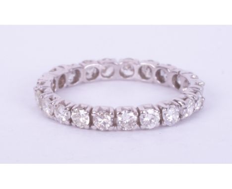 A white gold (no hallmarks &amp; not tested) full eternity ring set with approx. 1.06 carats of round brilliant cut diamonds,