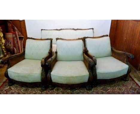 An Early 20th Century Four Piece Bergere Sitting Room Suite, comprising of a three seater sofa and three matching armchairs a