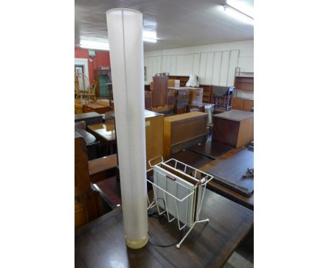 A standard lamp and a magazine rack 