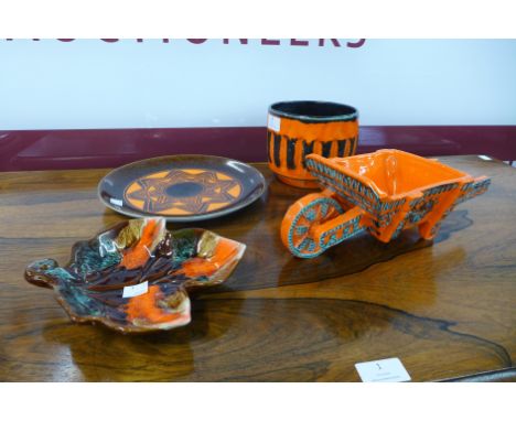 A mid 20th Century Vallauris porcelain leaf moulded dish, a wheelbarrow shaped planter and two others 