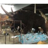 Animatronic Woolly Rhinoceros standing on a rock, Dimensions Approx. Height 3m, Length 3.8m, Gross