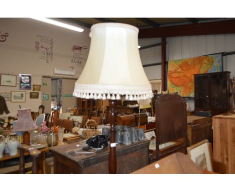 A mahogany standard lamp and shade 