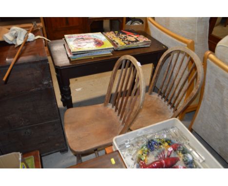 A pair of elm seated stick back kitchen chairs 