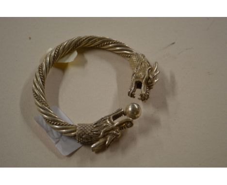 A Chinese white metal bangle 