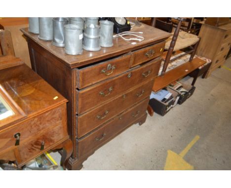 A Georgian oak chest fitted two short over three long drawers raised on bracket feet