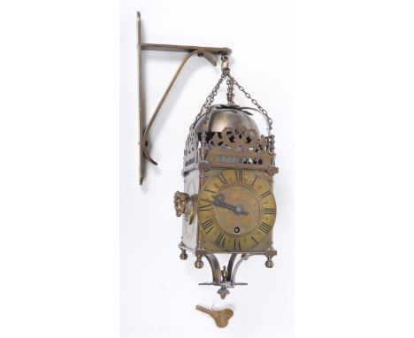 A 20th Century gilt brass lantern clock, after Thomas Kniston
Of typical form the bell supported by arcaded strut and pierced