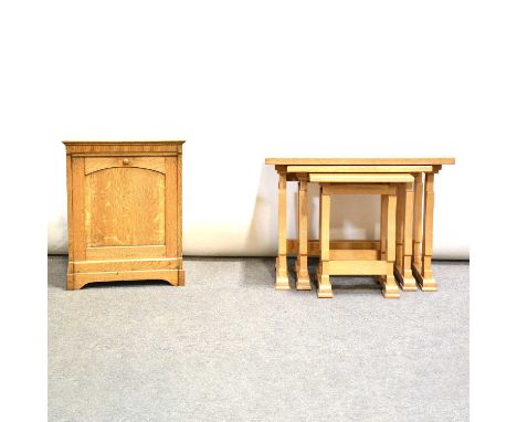 Nest of three light oak coffee tables, Elton Furniture Limited, the largest 61x45cm, height 46cm, and a light oak purdonium.Q