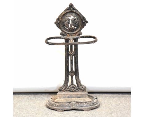 Victorian cast iron stick stand, with drip tray, width 34cm, height 64cm.