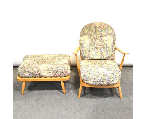 Ercol beech framed lounge chair and footstool, spindle hoop back, with original upholstered pads, armchair width 70cm, stool 