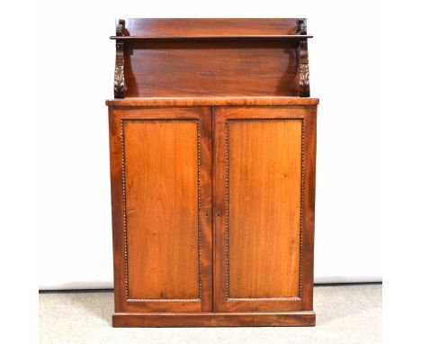 Early Victorian mahogany chiffonier, the upper shelf with acanthus scroll supports, the base with two panelled doors, plinth 