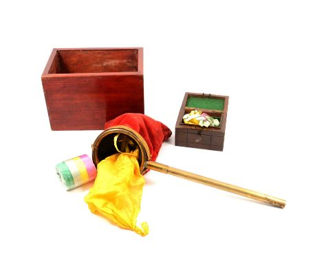 Collection of Magician's equipment and tricks, including illusion box, vintage Change Bag with rotating handle and red velvet