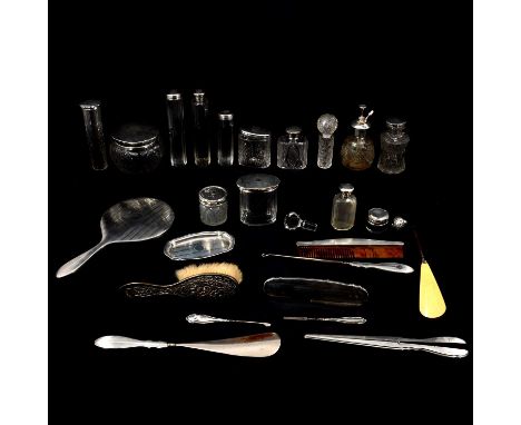 Collection of silver dressing table requisites, including a hand mirror, jars and bottles, atomiser, comb, pin dish and ebony