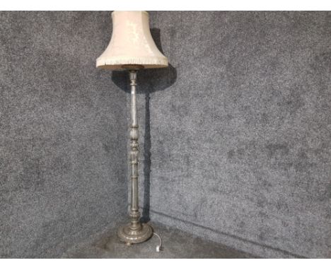 A silvered carved wood standard lamp with floral cream tasseled shade (lamp needs attention).