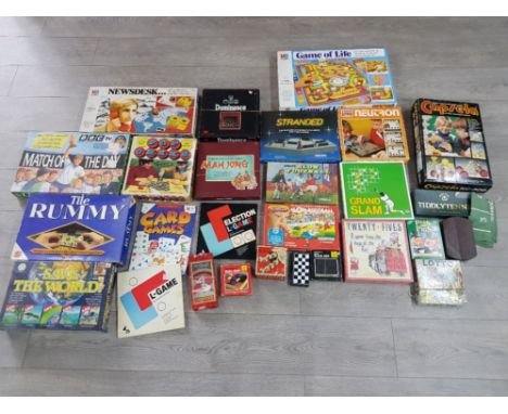A quantity of boardgames to include Tile Rummy, Save the World, Stranded etc.