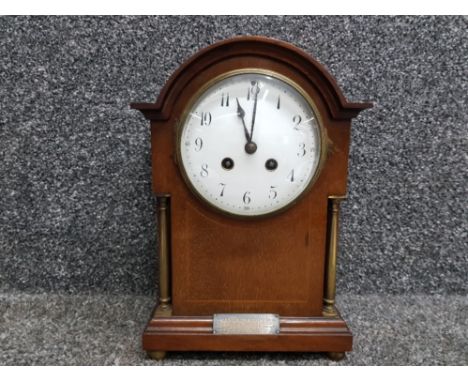 An early 20th century inlaid mahogany mantle clock with enamel Arabic dial, presentation plaque, 29.5cm high, with key.