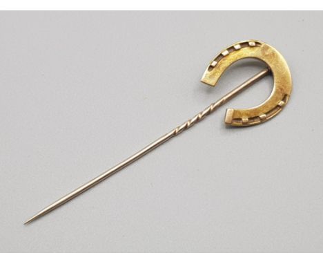 Victorian yellow metal stick pin in the form of a horseshoe, indistinct stamp to reverse, weight 5g