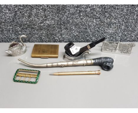 Silver plated swan pincushion, enamel buckle, pewter letter holder, Stratton compact, gold plated pencil, pipe rest, and two 