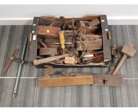 A collection of wood working planes and other hand tools.