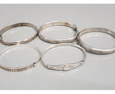 5 x ladies silver bangles, 3x hollow patterned bangles with safety chains, 1x ornate celtic design with cubic zirconia, 1x or