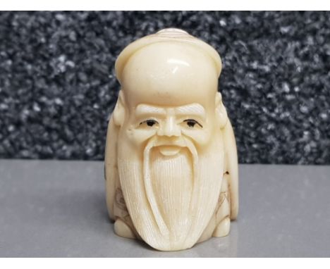 Hand carved possibly bone Netsuke in the form of a village elder