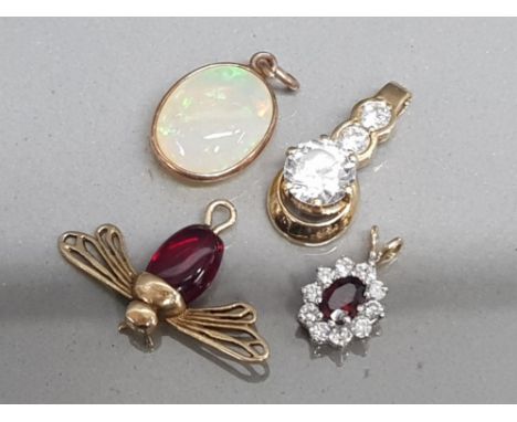 Four 9ct yellow gold pendants includes 1x garnet &amp; cz cluster, 3 stone cz, opal &amp; fly with red stone, 7.3g gross