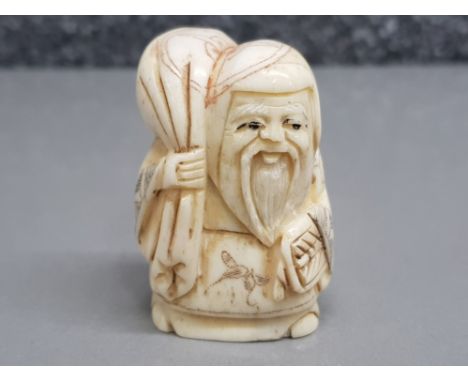 Hand carved possibly bone Netsuke in the form of village elder