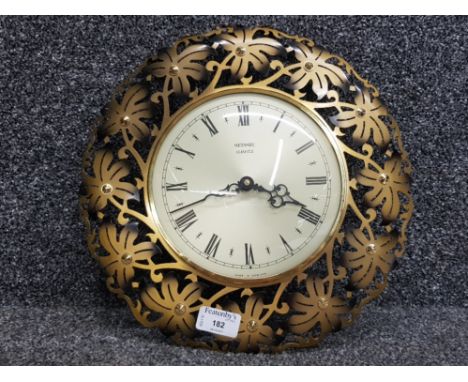 Metamec flower burst retro wall clock.