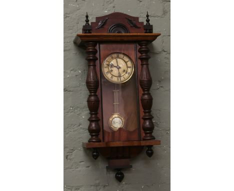 A Victorian mahogany cased Kienzle eight day wall clock with enamel dial chiming on a coiled gong made in Germany with key an