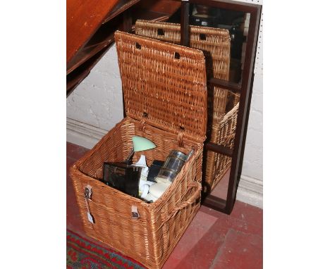 A twin handled basket and contents to include magnifying glass and telescope set, leather goods, silver plate tankard and a m