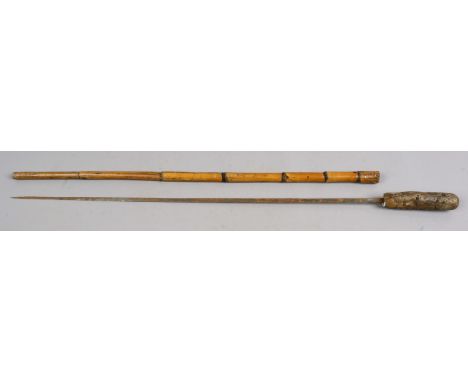 A stepped malacca sword stick. Condition Report. To be used as a guide only. Shaft split and blade rusted.