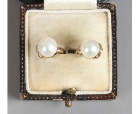 A pair of 9ct gold and cultured pearl ear clips.