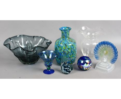A collection of decorative clear and coloured glassware to include art glass vases, peacock ornament etc.