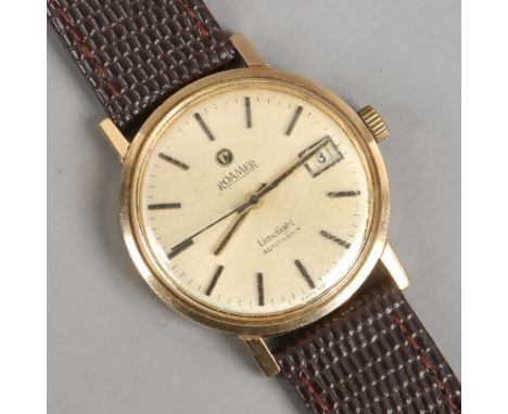 A vintage gents 9ct gold presentation Roamer lime light automatic wristwatch with date display.