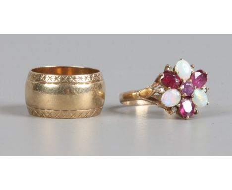 A 9ct gold opal and garnet floriform set ring size P1/2 along with a 9ct gold band, size N, gross weight 10 grams.