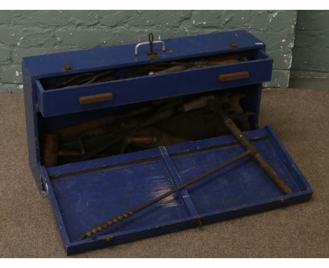 A painted tool chest with internal drawer and contents of hand tools along with a Victorian winding handle and a boring tool.